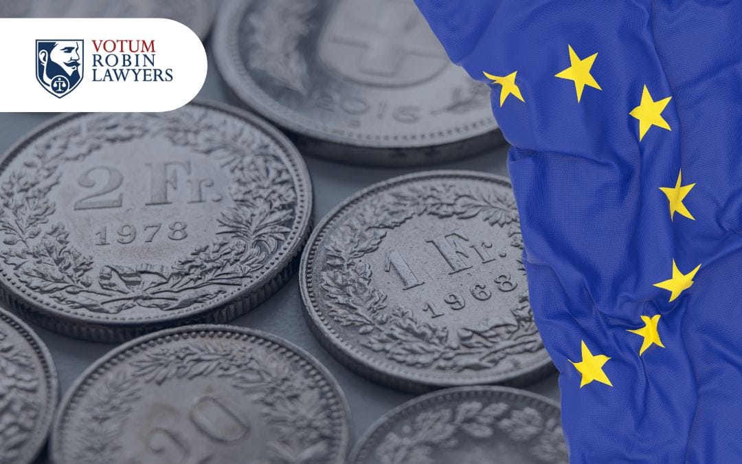 wyrok TSUE dla Frankowiczów, monety frank szwajcarski i flaga unii europejskiej