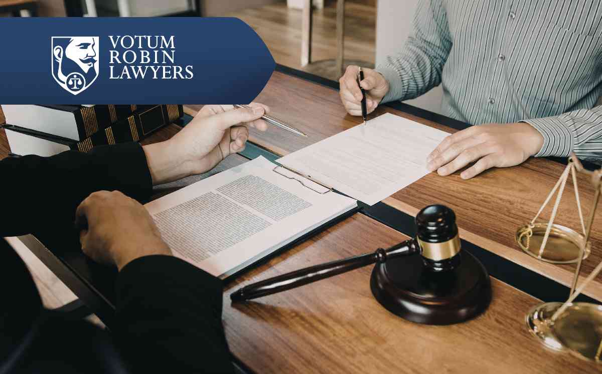 Votum Robin Lawyers logo on a collage of US dollars and other currencies, suggesting financial settlements/s legal finance.