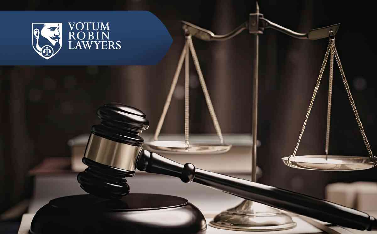 Votum Robin Lawyers logo on a collage of US dollars and other currencies, suggesting financial settlements/s legal finance.